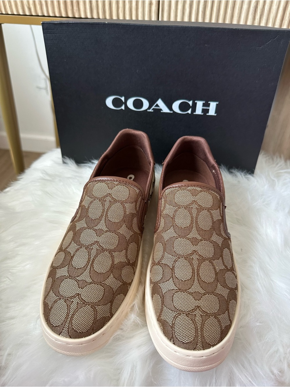 Coach woman’s Brown Signature Slip-On Sneakers